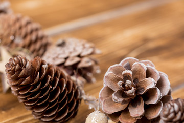 pinecones with wooden background