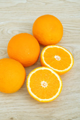 Oranges fruit on a wooden table.