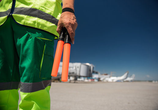 Ready to work. Close up of man hand holding signal wands. Copy space in right side