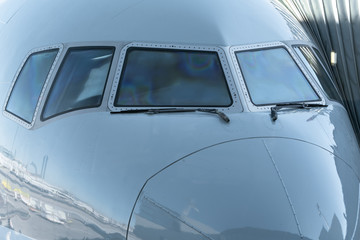 Fototapeta premium Close up of a jet airplane cockpit Front view of the airplane window with windshield wipers.