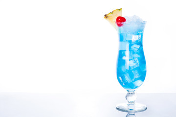 Blue Hawaiian cocktail on white background. Copyspace

