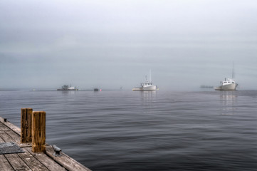 Fototapeta na wymiar Moored Pleasure Boats in Fog