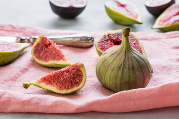 figs on a pink napkin, cut, tropical fruit, concept, copy space