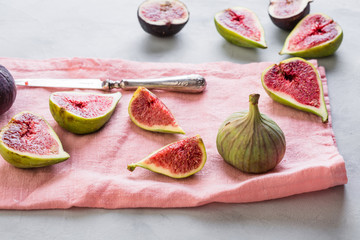 figs on a pink napkin, cut, tropical fruit, concept, copy space
