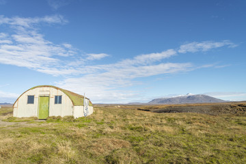 Fototapeta na wymiar An abandoned shepherd's hut near Sandvatn lake . The road to this area just for off-road car.