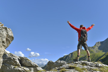 hiker on peak mountain 