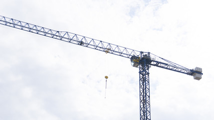 Crane / Cranes on Blue Sky With Clouds for Construction Advertising Design 