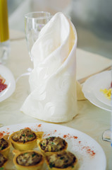 Beautiful linen napkins on the festive table.