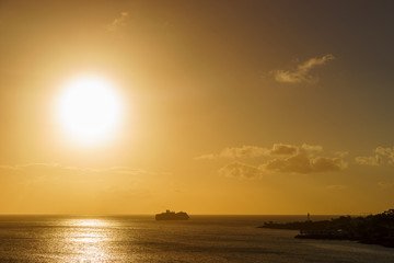 Huge ship underway at sunset