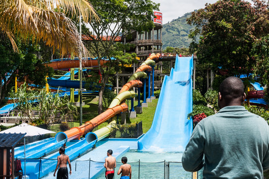 Water park, pool area with slides on a sunny day