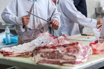 Meat beef Thai-French or Ko Khun Phon Yang Kham at Sakon Nakhon Thailand. And the butcher cutting...