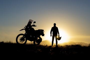 Obraz na płótnie Canvas sunrise motorbike journey and happy morning