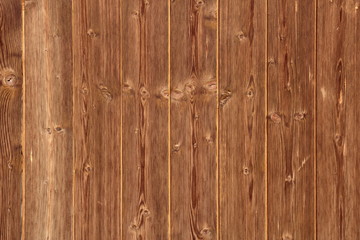 Braune Holzwand mit astiger Maserung