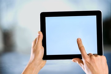 Male hands holding a tablet PC with space for you text isolated