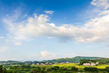 Pastoral villages under blue sky and white clouds