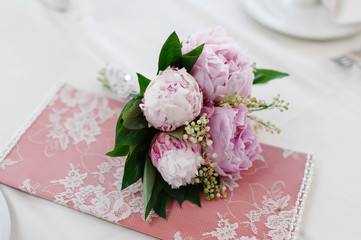 Tender bridal bouquet with pink flowers on the table. Wedding concept
