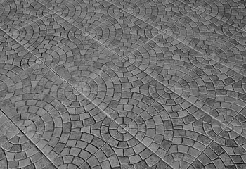 patterned paving tiles, ceramic brick floor background - monochrome