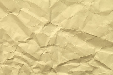 Paper beige color is crumpled and aged. Background light brown in retro style, strongly crumple.
