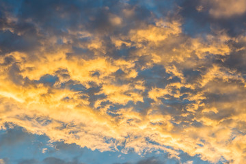 Dramatic sunset cloud with blue and gold color