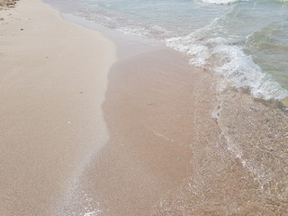 sandy beach and clear blue water