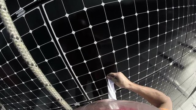 Rope Access Technician Cleaning Photovoltaic Panel Pov