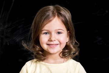 Happy little girl looking at camera