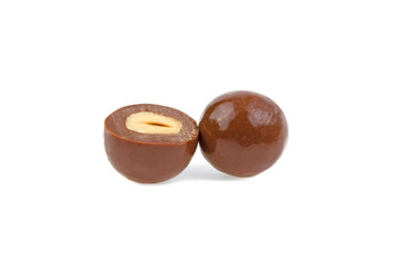 round chocolate candy with a nut on a white background