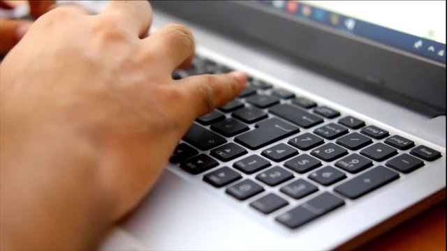 hands typing on a keyborard