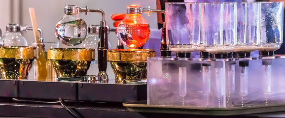 Showcase Syphon Coffee maker by syphonist./ Syphon Coffee or Vacuum Coffee is full immersion tasteful and picture show boiling water, stunning vacuum process by Beam heater.