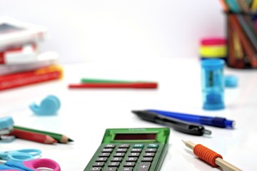 Back to school concept-close up of school supplies on a white background.