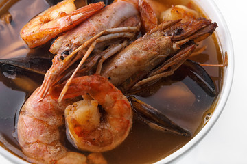 Seafood soup. Shrimp. Mussels. The scallop. On a white background