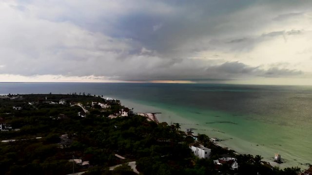 Aerial shot of a tropical storm rolling into Isla Hobox, Mexico