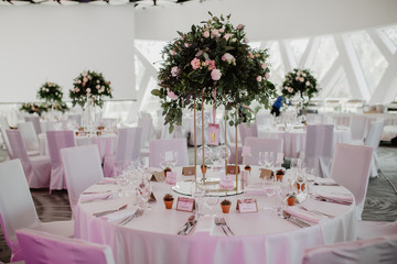 Wedding venue reception table sitting decoration with flowers and candles