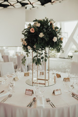 Wedding venue reception table sitting decoration with flowers and candles