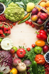 Fresh farm fruits vegetables berries, cherries apricots strawberries cabbage broccoli cauliflower squash tomatoes carrots spring onions beans beetroot, pepper, copy space, top view, selective focus