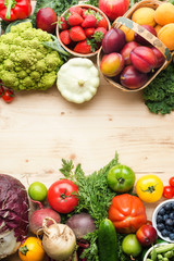 Fresh fruits vegetables berries assortment on wooden table, copy space, top view, selective focus
