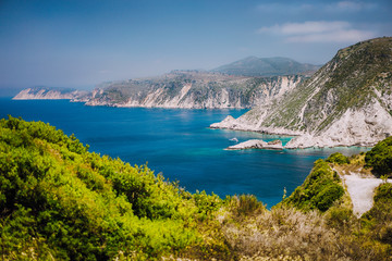 Coastline near Agia Eleni and Pitani beach in Kefalonia Island, Greece. Most beautiful rocky wild beaches with clear emerald water and high white limestone cliffs landscape