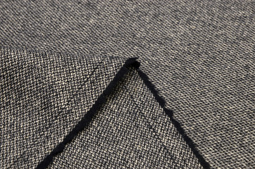 Suit fabric, tweed black and white from wool.