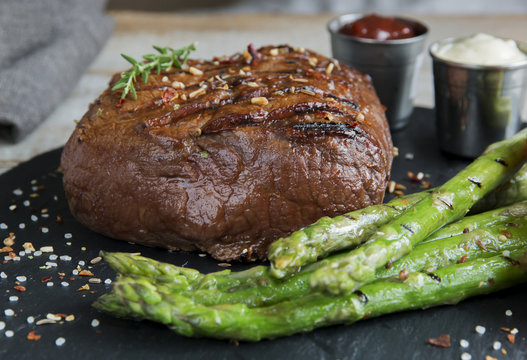 beef steak grilled with asparagus tomatoes spice and sauce