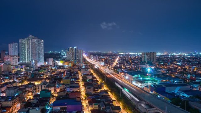Manila skyline showing full cars movement on toll highway road