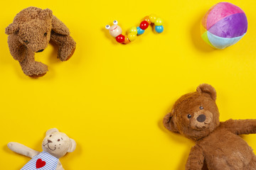 Kids toys background with teddy bear and colorful toys