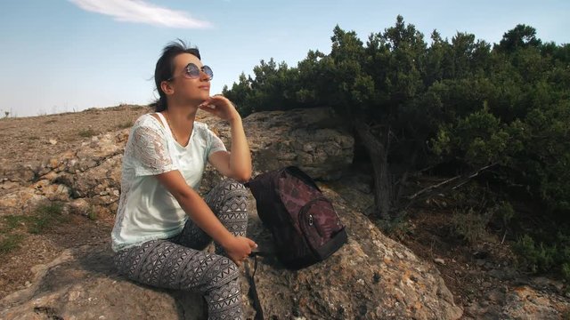 Tired woman traveler waching nature