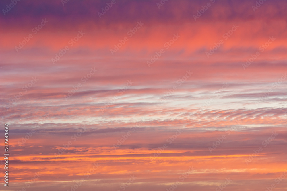 Wall mural background of the evening sky and amazing clouds.