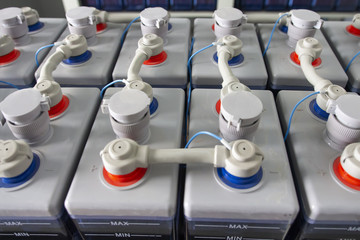 Rows of batteries in industrial backup power system. Battery pack in battery room in power plant....