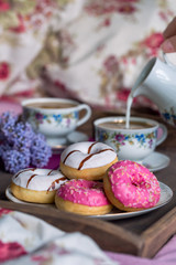 Breakfast in bed with coffee and donuts