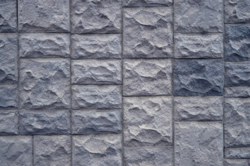Stone brick background. Rubble masonry wall. Stone wall made of various sizes stone .