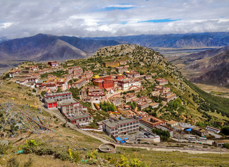 Tibetan Ganden Buddhist Monastery lies in a hilly natural amphitheater Mountains and dramatic views...