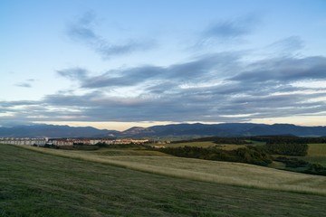 Obraz premium Sunrise and sunset over the hills and town. Slovakia