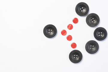 black buttons for sewing on a white background