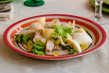 Healthy salad with chicken and vegetables in bowl